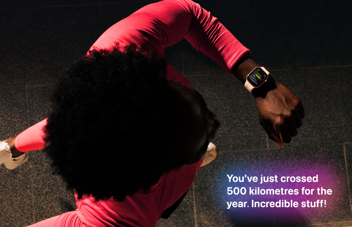 A person checks progress on Apple Watch Series 11 Workout app while running