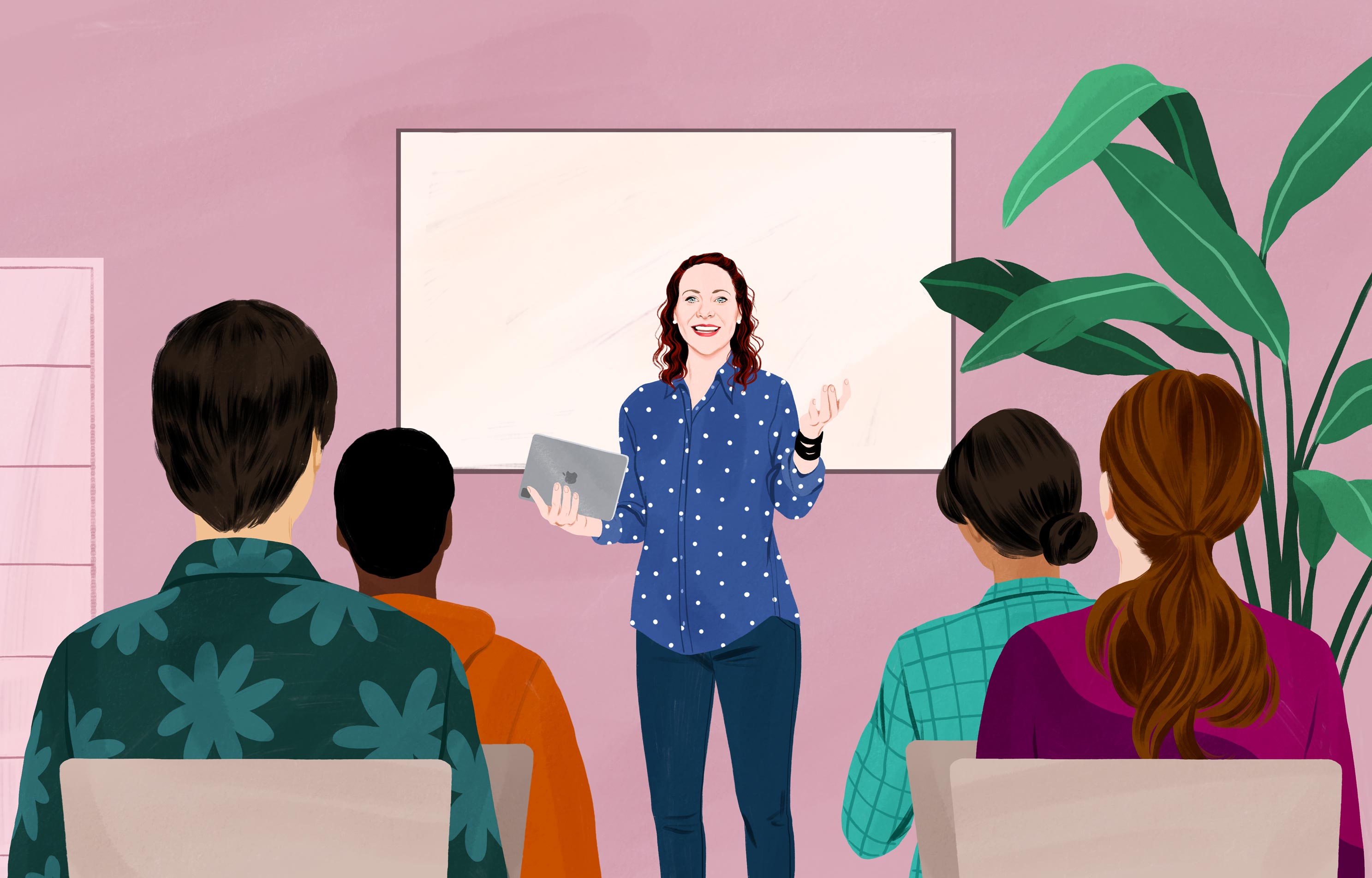 Jessica sorride con in mano un iPad, in piedi davanti a un gruppo di persone, e gesticola come se stesse spiegando qualcosa. 