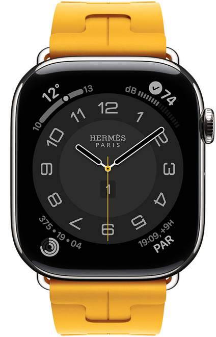 Apple Watch Hermès Series 11, esfera Circulaire (aguja horaria, minutero y segundero, logotipo de Hermès París, complicaciones: Tiempo, anillos de Actividad, hora de París e Índice UV), caja de titanio, color plata, lateral derecho, Digital Crown, con la correa Simple Tour Kilim, color Jaune (amarillo canario), fluoroelastómero