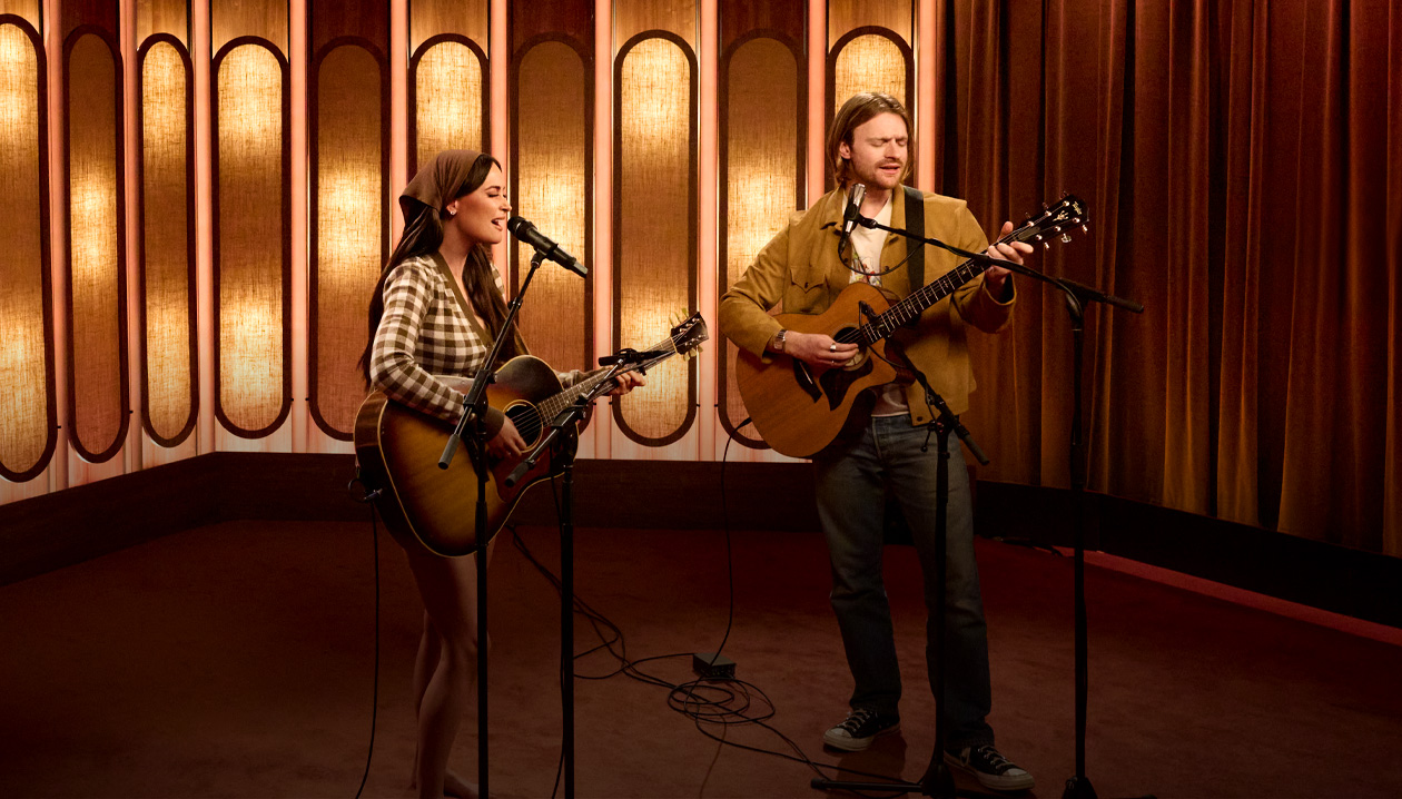 Kacey Musgraves and FINNEAS singing and playing guitar together